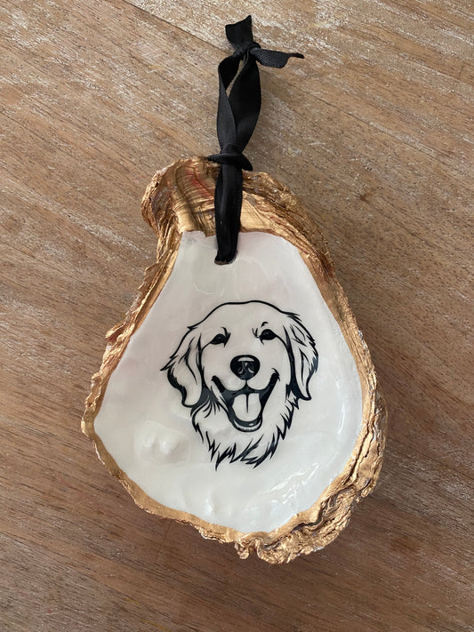 Oyster shell ornament with image of golden retriever 